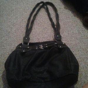 Black bag with braided straps and buckle accent