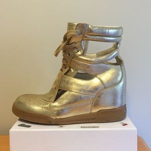 Marc Jacobs gold sneaker wedges.