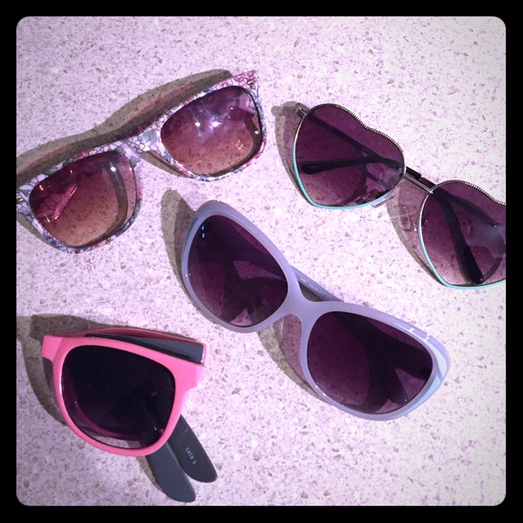 Four pairs of fun sunglasses.