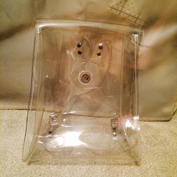 Clear backpack and MK green shirt