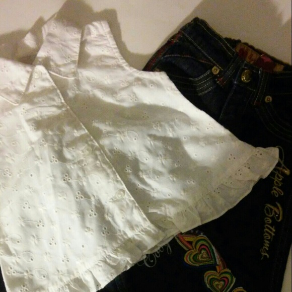 Cute little girl , sleeveless top . 2 pair of jean