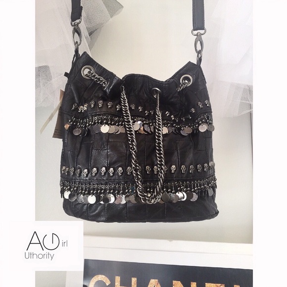 Genuine Leather skull-studded bucket bag.