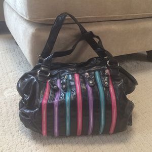 Black handbag with  multicolored zippers