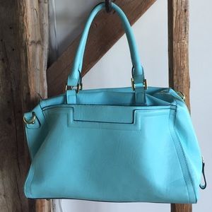 Gently used bright blue bag.
