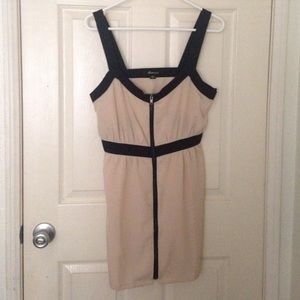 Cream colored dress with black trim