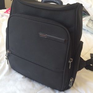 Tumi black backpack