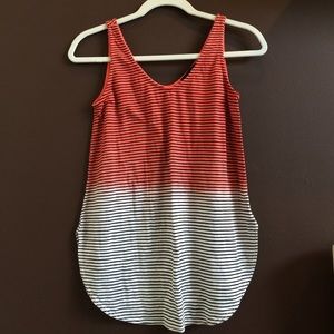 A orange and white, stripped ombré tank