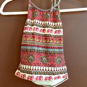 A cropped, tribal patterned halter top