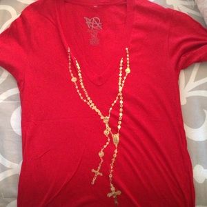 Red tunic with gold rosary printed on it