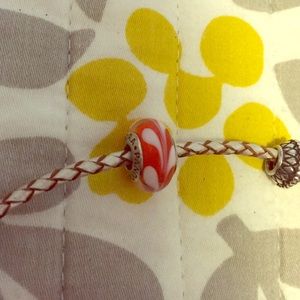 Orange and white pandora glass charm