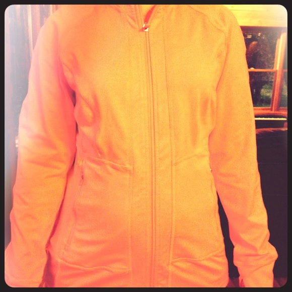 Bright salmon colored athletic jacket