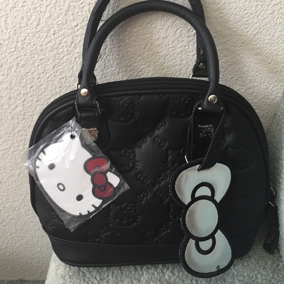Hello Kitty Handbags - NEW NWT Hello Kitty embossed Blk Small Bag