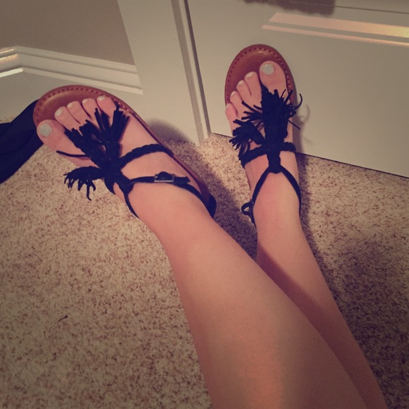 Black tassel flip flops