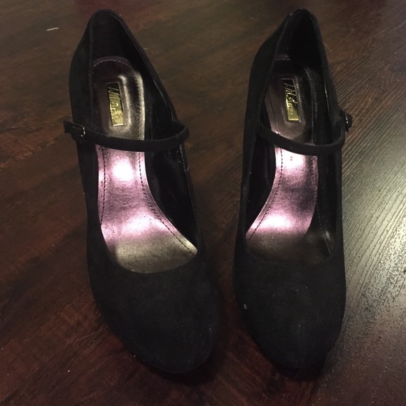 Black suede heels with a strap