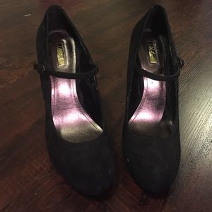 Black suede heels with a strap