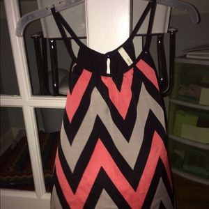 Coral and black chevron open back top