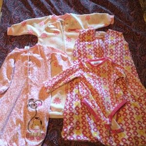 Three different baby girl sleep sacks.