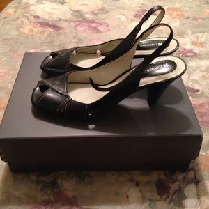 Black peep toe sling back .