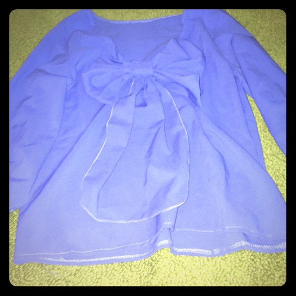 Blue half sleeve blouse with a back bow.