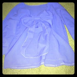 Blue half sleeve blouse with a back bow.