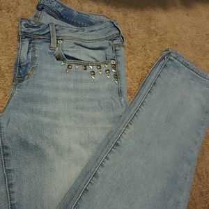 Light wash studded skinny jeans