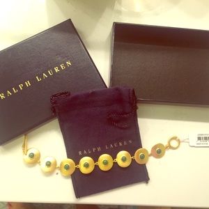 Gold bracelet with green detail