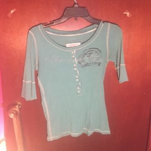 Turquoise half sleeve shirt.