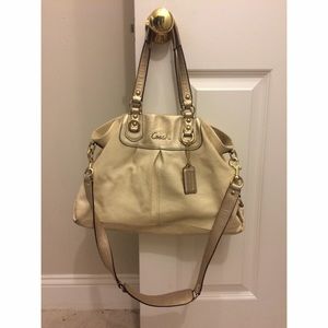 Off white leather coach hand bag with gold