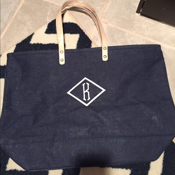 Navy blue beach bag with "K" initial