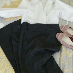 Black slacks with small white polka dots