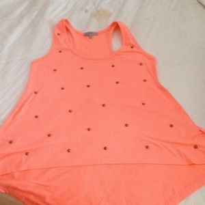 A coral tank top with studs