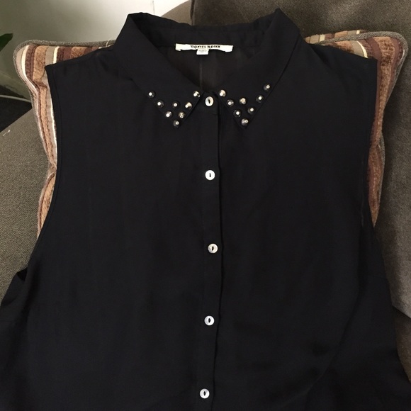 Black sleeveless and spiked blouse