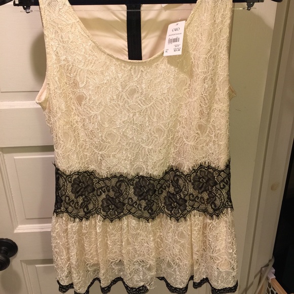 Brand new lined-lace peplum top