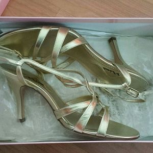 Gold strappy high heels