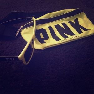 VS fanny pack, and matching sunglasses.