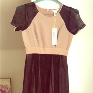 BCBG dress. Tan color with black lace. Nwt