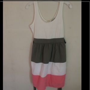 A cute little dress with pink and grey and white