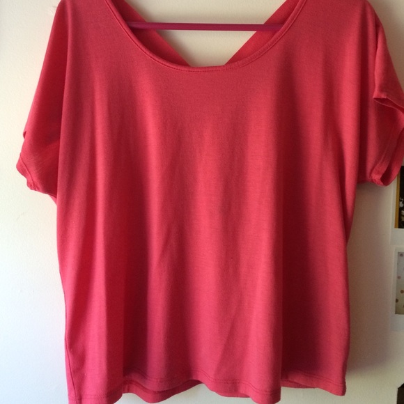 Bright pink crop top with cris cross back