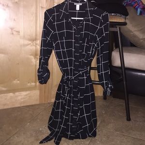 Black polo collared button up with tied waist.