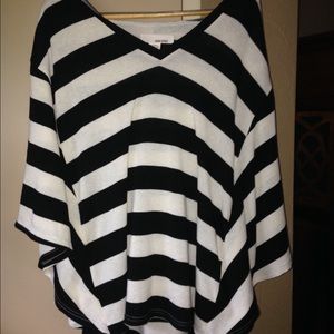 Flowing shirt with attached sleeves and hood