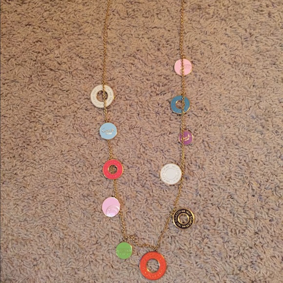 Coach necklace and perfume.