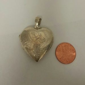 Sterling heart shaped locket engraved.