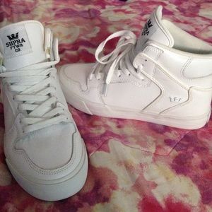 All white Supra shoes