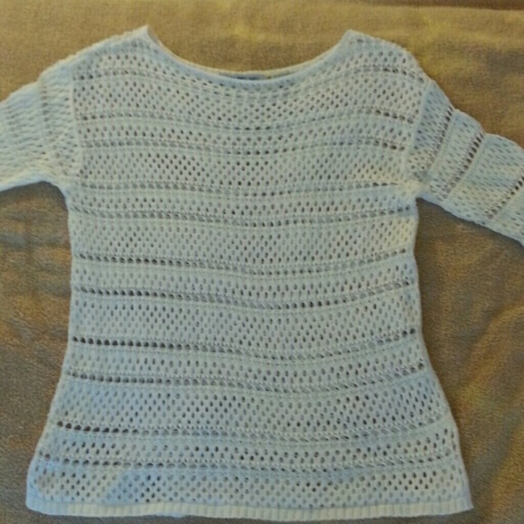 White crochet-like sweater