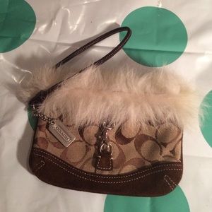 Authentic COACH faux-fur trimmed wristlet