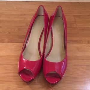 Red patent peep toe pumps