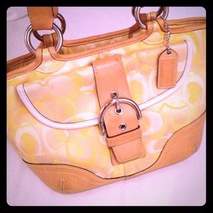 Gently used AUTHENTIC Coach signature purse.