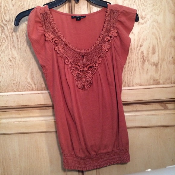 Dark orange top