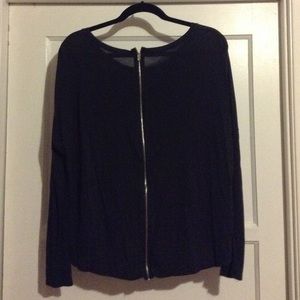 Simple black top with zipper back.