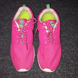 Pink nike roshes.